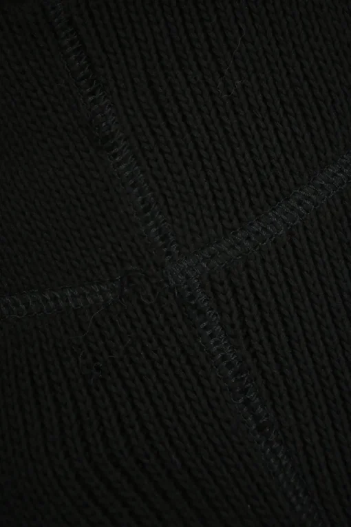 Black cotton paneled jersey knit drop-waist bustier mini dress with woven poplin ruffle skirt