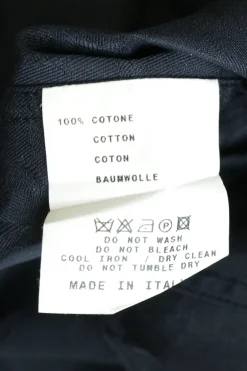 Black cotton poplin jabot collar button-front shirt with flounce button cuffs