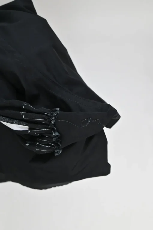 Black cotton poplin point collar dolman short sleeve button-front swing shirt with printed side inserts