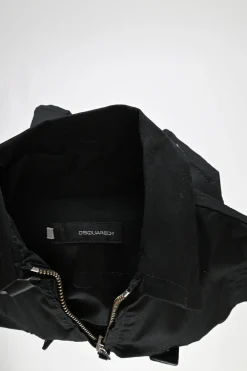 Black cotton-blend gabardine point collar zip-up sleeveless biker jacket with leather strap appliqué