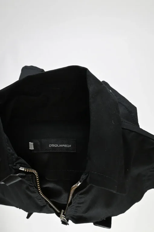 Black cotton-blend gabardine point collar zip-up sleeveless biker jacket with leather strap appliqué
