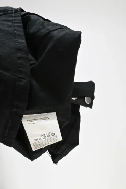 Black cotton-blend gabardine point collar zip-up sleeveless biker jacket with leather strap appliqué