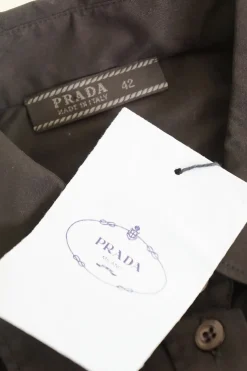 Black cotton-blend poplin button-front shirt with chest patch pocket and curved hem
