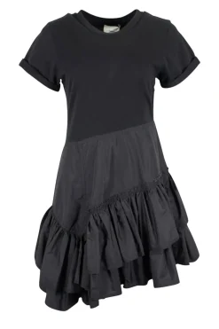 Black crew neck with folded hem short-sleeved mini dress. Adorned with layered flared pleated skirt and feature zipper closure on the side