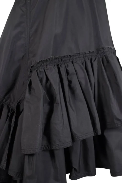 Black crew neck with folded hem short-sleeved mini dress. Adorned with layered flared pleated skirt and feature zipper closure on the side