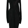 Black draped jersey knit cowl neck dolman sleeve tunic shift dress with empire waist and tulip skirt