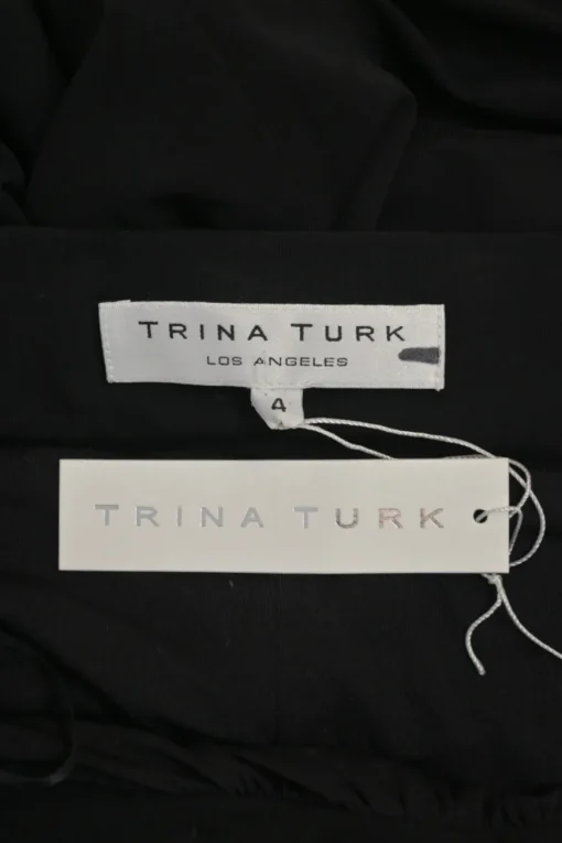 Black draped rayon-spandex blend midi sarong skirt with chainlink waistband appliqué