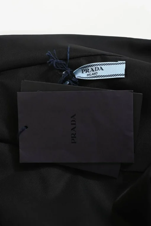 Black draped recycled polyamide cold-shoulder draped blouse with chest patch pocket and snap buckle belt