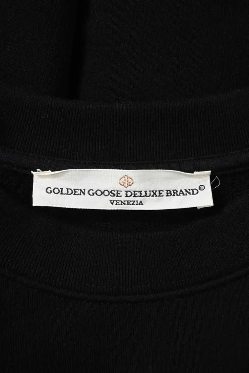Black French terry crewneck pullover sweatshirt with glitter flocking detail