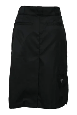 Black nylon gabardine wrap-style skirt with enameled silver-tone metal triangle logo motif