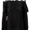 Black off-shoulder top with black flower applique chest flap