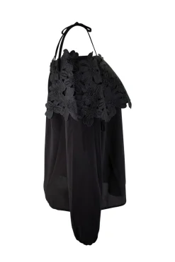 Black off-shoulder top with black flower applique chest flap