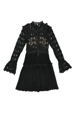 Black paneled guipure lace bib A-line peek-a-boo mini dress with flounce sleeves and plissé skirt