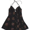 Black polyester keyhole-front Renee peekaboo halter criss-cross back skater dress featuring rose motif