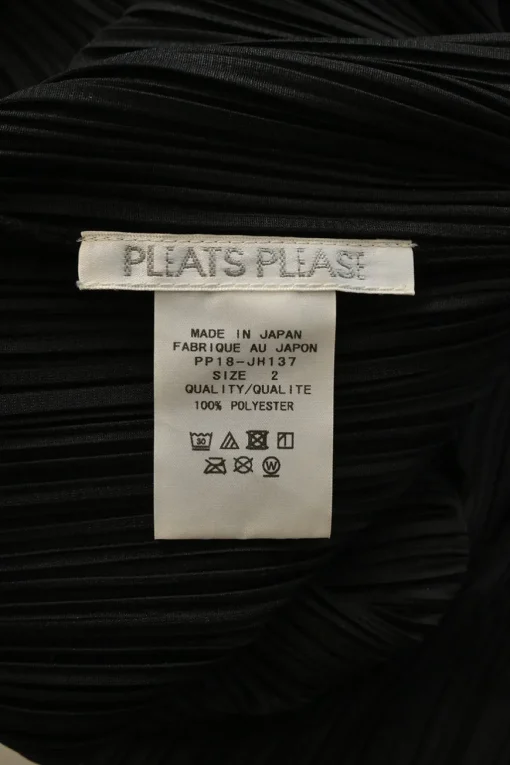 Black polyester plunge back sleeveless tie-waist plissé A-line knee-length dress