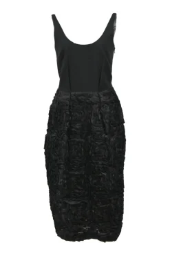 Black polyester scoop-neck sleeveless sheath dress featuring rosette-embellished skirt and tuck pleat waistline