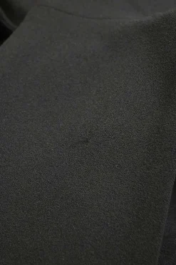 Black polyester-blend mixed-media turtleneck sheath dress with cascade draped hip sash appliqué