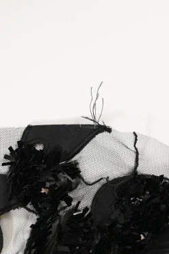 Black sequin-embellished silk tulle peek-a-boo jewel neck gown with contrasting slip insert