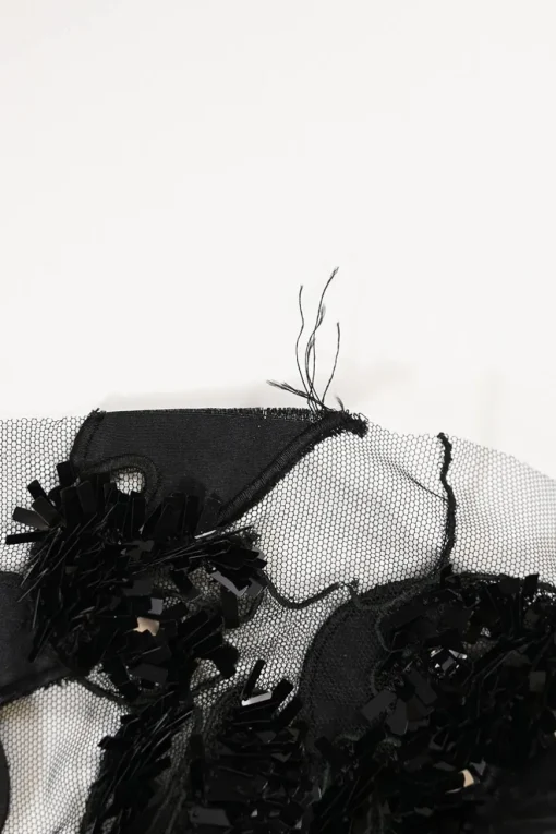 Black sequin-embellished silk tulle peek-a-boo jewel neck gown with contrasting slip insert