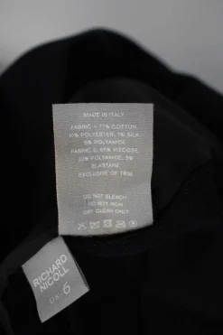 Black short sleeve shift dress with panel of off-white and black metallic fabric