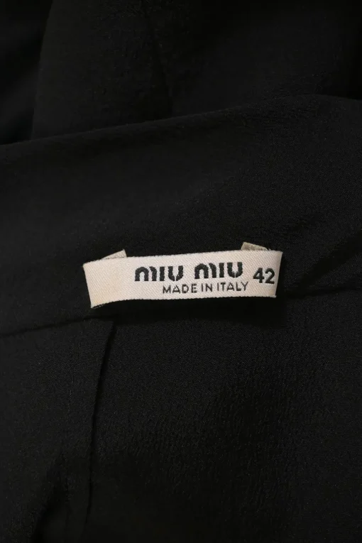 Black silk portrait neck drop-waist shift dress with knife-pleat skirt
