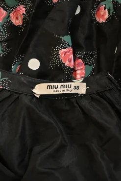 Black silk rose print taffeta long sleeve A-line knee-length dress with gathered neckline and tiered skirt