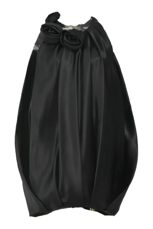 Black silk satin cocoon-style sleeveless balloon dress with rose appliqués at neckline