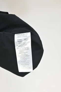 Black silk V-neck sleeveless apron skort mini dress with contrasting foulard skirt insert