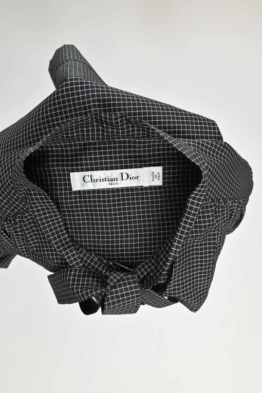 Black silk windowpane check tie-neck puff-sleeve blouse with button fastening at centre front