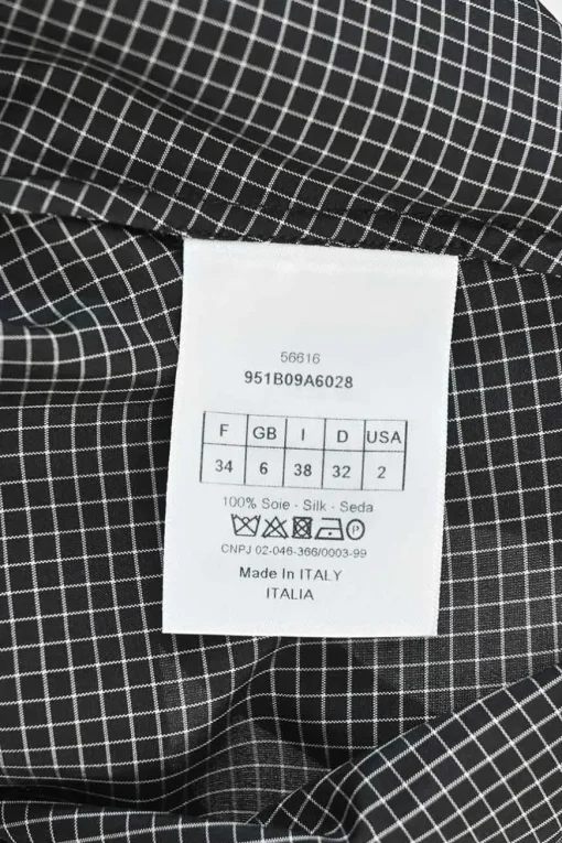 Black silk windowpane check tie-neck puff-sleeve blouse with button fastening at centre front