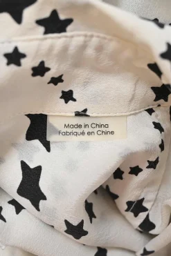 Black two-tone silk star print spread collar button-front shirt with cargo chest patch pockets