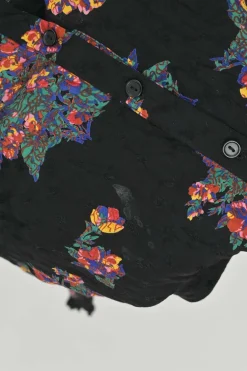 Black viscose floral print raglan sleeve button-front blouse with classic collar