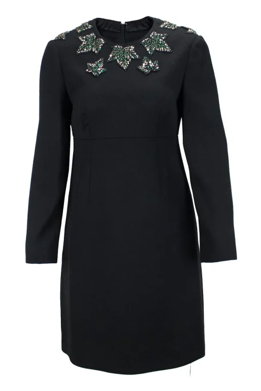 Black wool long sleeve mini dress with emerald and crystal stone embellishment around neckline, double pleated bodice for figure fit.
