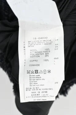 Black wool mixed-media raw edge solid and glen check tweed belted plissé knee-length skirt