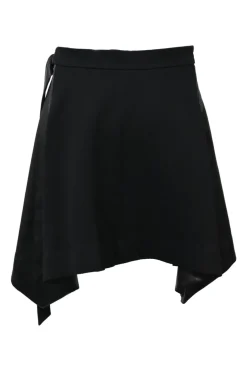 Black wool mixed-media tweed wrap-front handkerchief tailored skirt with pull tab belt and tonal faux leather inserts