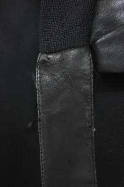 Black wool mixed-media tweed wrap-front handkerchief tailored skirt with pull tab belt and tonal faux leather inserts