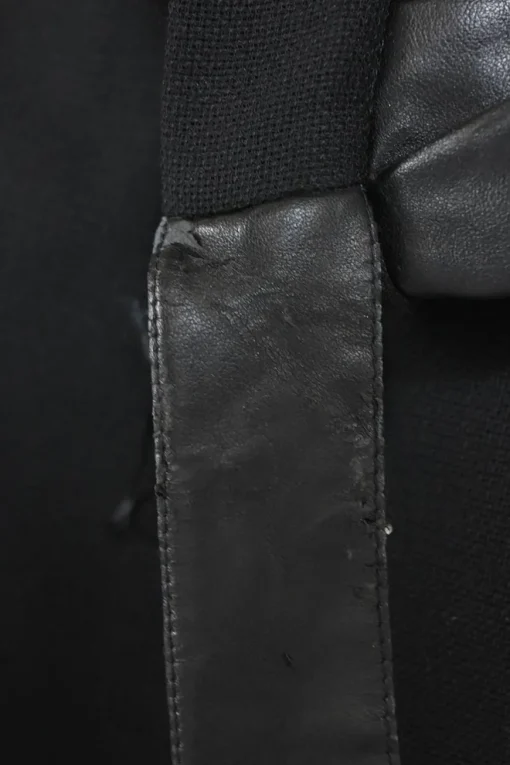 Black wool mixed-media tweed wrap-front handkerchief tailored skirt with pull tab belt and tonal faux leather inserts