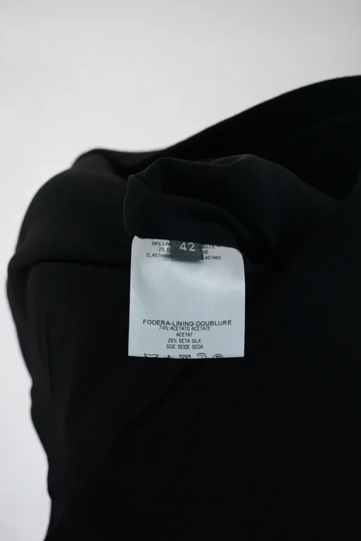 Black wool-blend bi-layer sleeveless apron-style sheath dress with slanted double-jet hip flap pockets