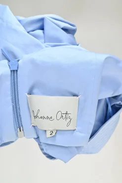 Blue bow-embellished cotton-silk blend off-shoulder blouse with gathered sleeves