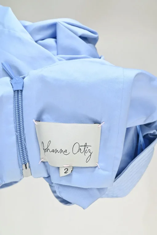 Blue bow-embellished cotton-silk blend off-shoulder blouse with gathered sleeves