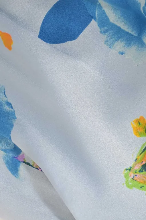 Blue draped silk floral print plunge neck tie-waist wrap-effect mini dress with padded shoulders