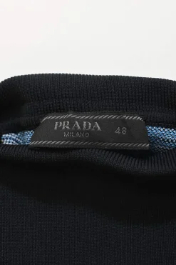 Blue polyester graphic jacquard knit turtleneck half-sleeve top with logo patch motif
