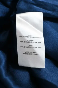 Blue polyester ruffle neck plissé swing dress with ribbon-tie fastening at centre front