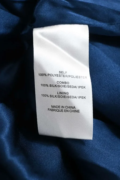 Blue polyester ruffle neck plissé swing dress with ribbon-tie fastening at centre front