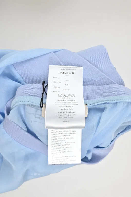 Blue semi-sheer cotton logo broderie Anglaise pullover top with contrasting rib collar, cuffs and hem