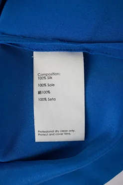 Blue sleeveless shift dress with beads embellishment at collar