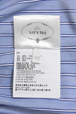 Blue striped chambray point collar button-front utility shirt dress featuring chest and hip patch pockets and elasticated waist