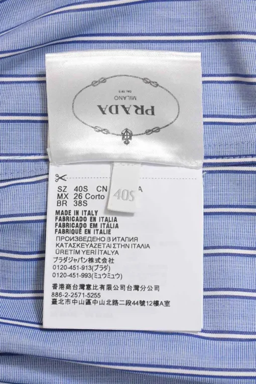 Blue striped chambray point collar button-front utility shirt dress featuring chest and hip patch pockets and elasticated waist