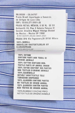 Blue striped chambray point collar button-front utility shirt dress featuring chest and hip patch pockets and elasticated waist