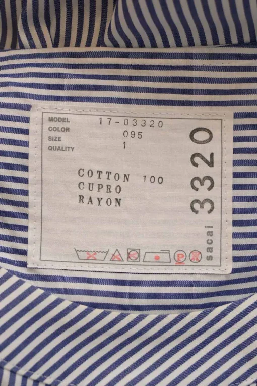 Blue striped cotton poplin cap sleeve swing-style blouse with tiered plissé hem insert